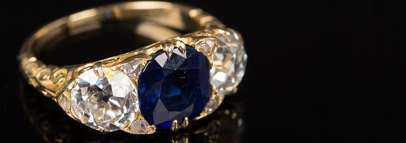 A gold, sapphire and diamond set three stone ring Hammer price: £9,000