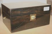 A Victorian coromandel jewellery box, the hinged lid and key escutcheon inlaid with mother-of-pearl.