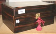 A Victorian coromandel work box, the hinged lid revealing a fitted interior, together with another Victorian writing box.