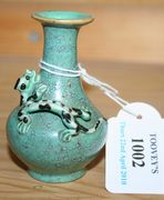 A Chinese robin's egg glaze diminutive vase, probably 19th Century, the squat body and flared neck applied with a chilong, height approx 7.5cm.