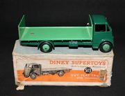 A Dinky Supertoys No. 513 Guy flat truck with tailboard, first type cab, finished in duo green, boxed (minor paint chips to tailboard, box creased and torn).