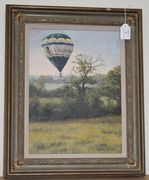 Stephen Hawkins - Hot Air Balloon above a Copse and Meadows, late 20th Century oil on canvas, signed, approx 39cm x 29cm, within a gilt composition frame.