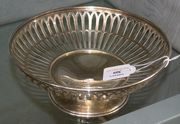 A sterling silver circular fruit bowl with pierced decoration on a circular foot, import mark London 1931, diameter approx 23cm.