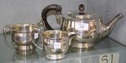 An Art Deco silver three piece tea set of circular form, comprising teapot, milk jug and two handled sugar bowl, Birmingham 1937 by Mappin & Webb.