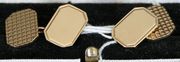 A pair of 9ct gold cut cornered rectangular cufflinks, with engine turned decoration to one side, Birmingham 1964, cased.