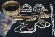 A collection of jewellery, comprising an oval gilt metal hinged bangle, a gilt metal and imitation turquoise chain link bracelet, a 9ct gold and amethyst set bar brooch, two further brooches, a gold nugget, a circular gold back and front pendant locket, with a neckchain, a Victorian amethyst set three stone ring, an imitation pearl necklace, a pair of oval colourless paste set buckles, a coloured paste set dress clip, a colourless paste bracelet, six various studs, three odd cufflinks, a foil backed mauve gem set clasp, and four further items.