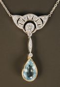 An aquamarine and diamond pendant necklace, the diamond set surmount mounted with the principal circular cut diamond at the centre, above a collet set pear shaped aquamarine drop.