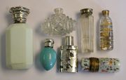 A Victorian silver and opaline glass scent bottle, the hinge lid with engraved decoration, a silver overlay glass scent bottle and stopper and five other various scent bottles (some faults).