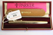 A 9ct gold Parker fountain pen with engine turned decoration, London 1970, with the original leather slip case, guarantee and red fitted case, boxed.