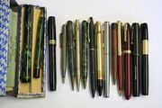 A marbled green and black plastic fountain pen, detailed 'The Special England', with the matching pencil in the original case, with two paper details, a silver cased propelling pencil, three Watermans fountain pens, an associated box, a Swan Visofil black plastic fountain pen, and eight further writing implements.