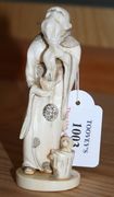 A Japanese carved ivory okimono, Meiji period, in the form of a bearded gentleman holding a chick (minor repair).
