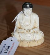 A Chinese carved ivory figure of Buddha, late 19th/early 20th Century, seated on a lotus base, signed.