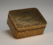 A Japanese Komai style damascened rectangular box, early 20th Century, of rectangular shape, the hinged lid decorated with a shaped panel depicting Mount Fuji against a dense leaf ground, the base interior decorated with butterflies, length approx 5.7cm.