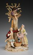 A Meissen porcelain apple picking figure group, early 20th Century, modelled as a couple with two children picking apples from a tree, underglaze blue crossed swords to base with incised numerals '2229', impressed '111' and red painted '43', height approx 26cm (faults).