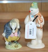 A Royal Doulton The Snowman Gift Collection 'Violinist Snowman', DS11, and a Beswick Beatrix Potter's figure 'Tommy Brock', mark BP-3a to base.