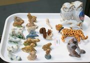 A Bing & Grondahl porcelain model of a chick, together with a small group of Wade Whimsies, a Portuguese model of two owls and a bonbonnière in the form of a leopard (faults).