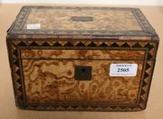 A mid-Victorian pollard oak tea caddy, the rectangular body inlaid with geometric borders, the hinged lid opening to reveal two lidded compartments (faults).