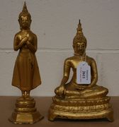 A 20th Century gilt cast metal model of a bodhisattva, seated in padmasana, and a similar standing figure.