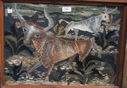 A mid-20th Century appliqué collage panel depicting two bulls in a landscape, approx 37cm x 51cm, within a painted pine frame.