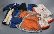 A Chinese pumpkin silk jacket with embroidered decoration and gilt braid, together with a collection of other Oriental gentlemen's and ladies' costume.