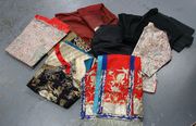 A Chinese terracotta gauze silk scholar's robe, a similar black silk jacket, a small group of Singapore Straits costume and other Oriental costume.