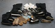 A quantity of Chinese black silk boots and other Oriental footwear, including a pair of beadwork and leather shoes.