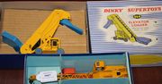 A Dinky Supertoys No. 964 elevator loader, a No. 971 Coles mobile crane, a No. 972 20-ton lorry mounted crane 'Coles', and a Dinky Toys No. 401 fork lift truck, all boxed (some paint chips, boxes lightly creased and scuffed).