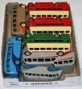 Seven Dinky Toys buses and coaches, comprising a No. 29b streamline bus, finished in grey and blue, two No. 29c double deck buses, finished in red and cream, a No. 29c double deck bus, finished in green and cream, a No. 29e single deck bus, finished in duo blue with blue wheels, a No. 29f observation coach and a No. 29g luxury coach (some paint chips).