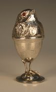 An Edwardian silver novelty egg cup and cover, modelled as a chick standing on a domed base, Chester 1909 by Sampson Mordan & Co, height approx 11cm.