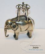 An Edwardian silver novelty hat pin cushion in the form of an elephant, Birmingham (date mark indistinct) by Adie & Lovekin Ltd, length approx 6.6cm.