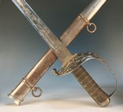 An ERVII 1887-pattern heavy cavalry officer's sword of the IV Dragoon Guards by Henry Wilkinson, No. 38948, with slightly curved single edged blade, length approx 89cm, etched with ERVII cypher, IV Dragoon Guards badge, 'AC de W', royal arms, etc, steel honeysuckle hilt with wire bound chequered horn grips and Wilkinson's Patent solid tang, in its steel scabbard, with photocopy of page from Wilkinson's Register, stating sword sold to A. Carton de Wiart, and some biographical details.  Note: Adrian Carton de Wiart won a Victoria Cross at La Boiselle, France, 2nd/3rd July 1916.