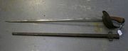 A 1908-pattern cavalry trooper's sword by Wilkinson, dated '15', with straight single edged blade, length approx 88cm, steel knuckle bowl, chequered composition grip, in its steel scabbard (scabbard and hilt overpainted black).