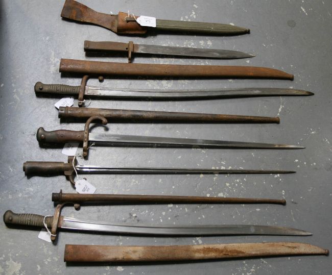 A First World War German ersatz bayonet, two French 1866-model bayonets, A First World War German ersatz bayonet, two French 1866-model bayonets,