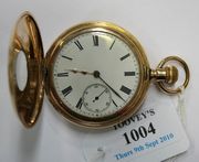 A gilt metal cased keyless wind half hunting cased gentleman's pocket watch, with a gilt lever movement detailed 'AM. Watch Co. Waltham. Mass', the enamelled dial with black Roman numerals and subsidiary seconds, within the case back later applied photographic images of a woman and a girl.