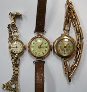 An Uno 9ct gold circular cased lady's wristwatch, on a 9ct gold bracelet, a Montex 9ct gold circular cased lady's wristwatch, Birmingham 1918, on an expanding bar link bracelet, and a 9ct gold circular cased lady's wristwatch, Chester 1927, on a leather strap.