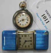 A silver and blue translucent enamelled rectangular cased folding purse watch, the square silvered dial with Arabic numerals, with retailer's mark 'Udall & Ballou', the case back detailed 'Sterling Silver Swiss Made', and a base metal cased keyless wind open-faced lady's fob watch.