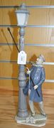 A Lladro porcelain model of a lamplighter, together with five various Lladro pamphlets.