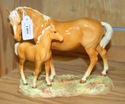 A Beswick mare and foal on base, second version, model No. 953, with palomino mare and foal.