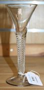 An airtwist stem wine glass, mid-18th Century, the drawn trumpet bowl on a multiple spiral plain stem and conical foot.