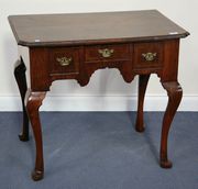 A mid-18th Century and later walnut lowboy, the moulded top above three drawers, raised on cabriole legs and pad feet, width approx 82cm (alterations).