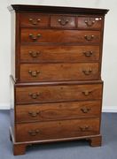 A George III mahogany chest-on-chest, the moulded and dentil pediment above three short and six long drawers, on bracket feet, width approx 120cm.