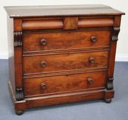 A Victorian mahogany chest of two short and three long drawers, on bun feet.