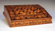 An early Victorian Tunbridge Ware writing slope, the double-hinged lid with a geometric panel within a border of mosaic flowers, opening to reveal a fitted interior, width approx 38cm.