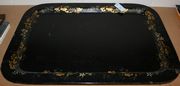 A large 19th Century papier-mâché tray of curved rectangular form, gilded with foliate scrolls and flowers, width approx 80cm.