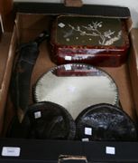 A Japanese lacquer box, Meiji period, of shaped rectangular form, the hinged lid inlaid with an ivory and mother-of-pearl panel depicting a bird and butterfly around prunus, together with three mirrors, two carved oak circular portrait panels and a kukri knife.