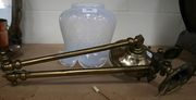 A Victorian brass single branch wall light with vaseline glass shade.