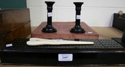 A Victorian ebonized cribbage box containing pegs and dominoes, together with a pair of ebony candlesticks, a pair of ivory glove stretchers by Tiffany & Co, and an early 20th Century board game, 'Petits Chevaux Alma Oie'.