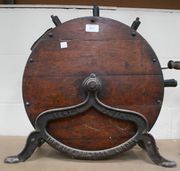 A Kents knife cleaning machine on an iron stand.