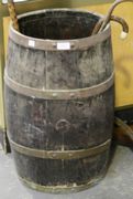 An early 20th Century oak coopered barrel with transfer printed coat of arms emblem (faults).