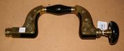 A Victorian ebony and brass mounted hand brace by Alfred Gardiner & Sons.
